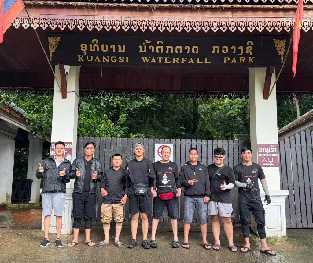style motorbikes customer and staff outside of the kuangsi waterfall in laos